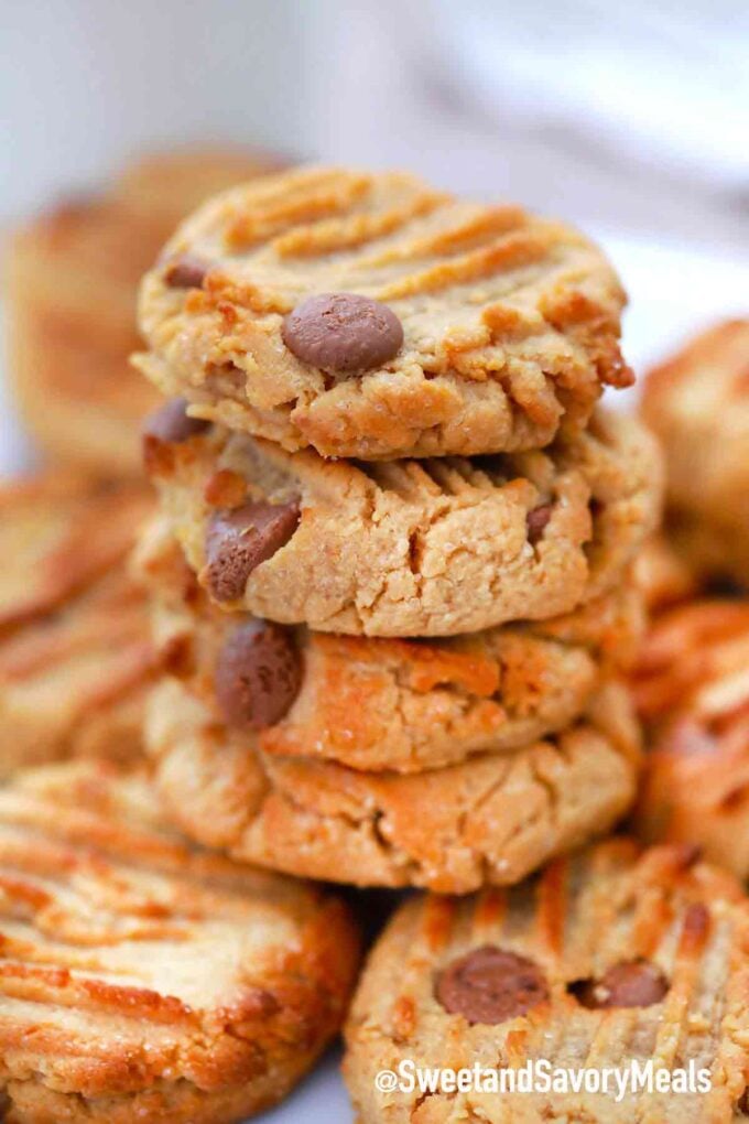 A stack of crispy peanut butter cookies with chocolate chips