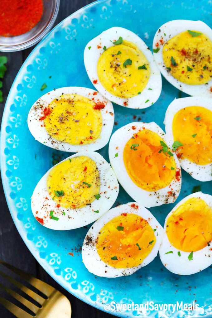 Perfectly boiled eggs seasoned and laid on a plate.