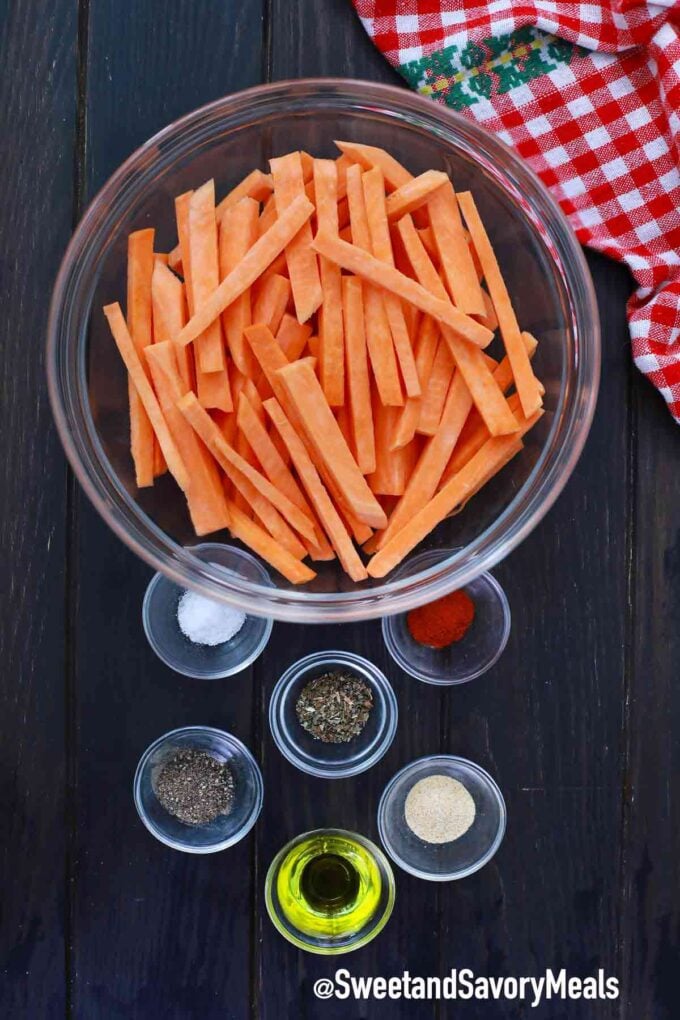 slices of sweet potato fries and seasoning on the table