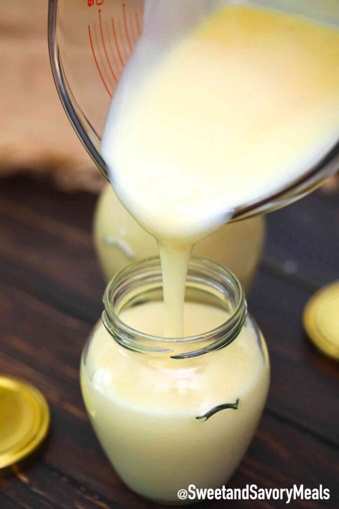 adding condensed milk to a jar