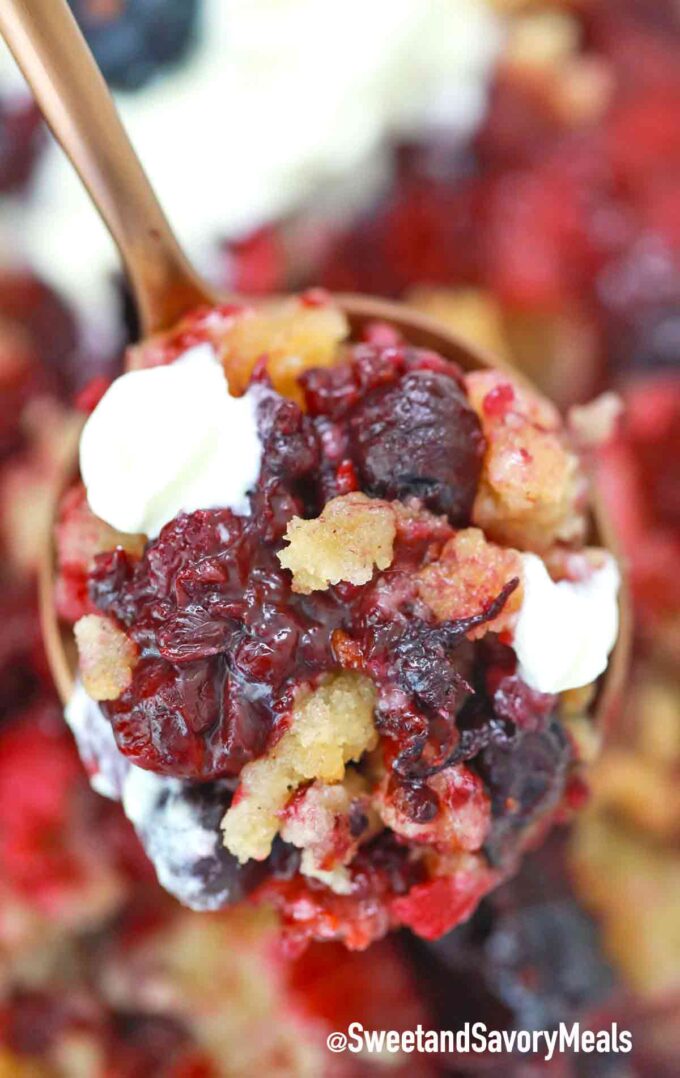 a spoon of instant pot berry cobbler