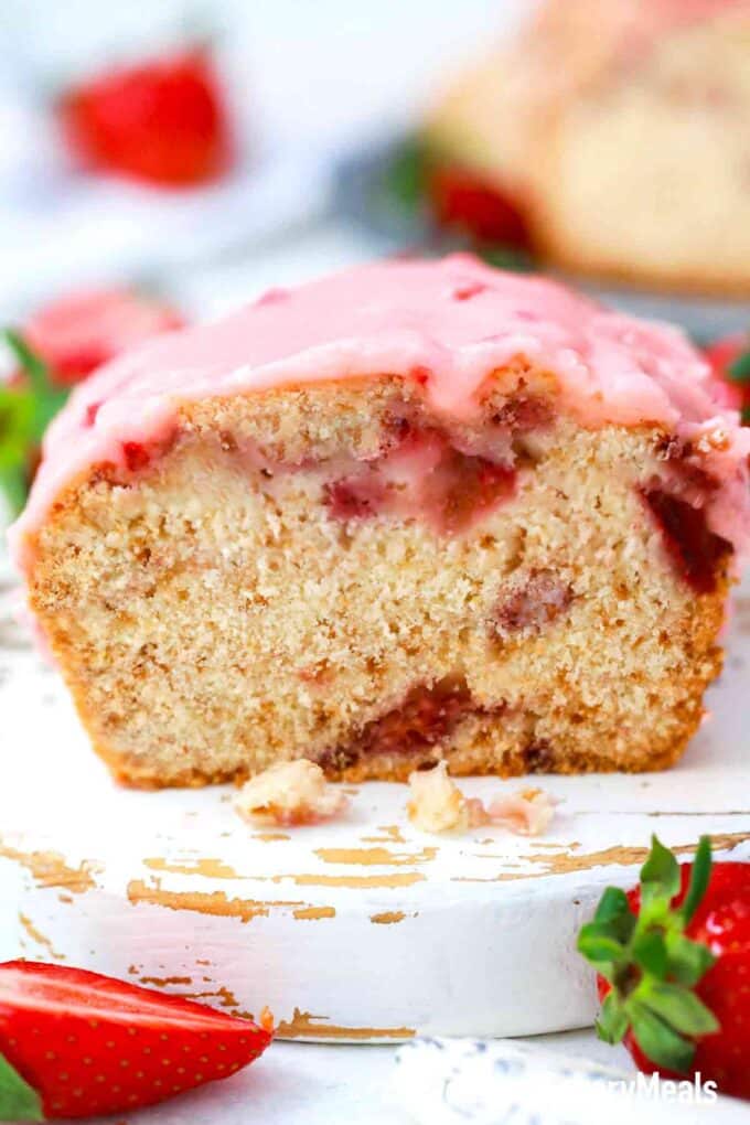 strawberry bread loaf sliced revealing moist interior with strawberries