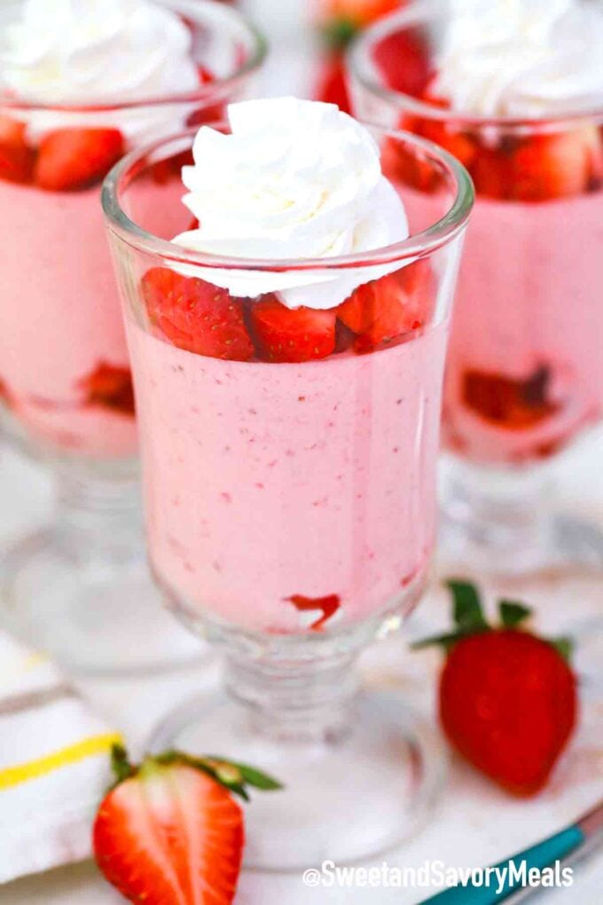 strawberry mousse with strawberries and whipped cream