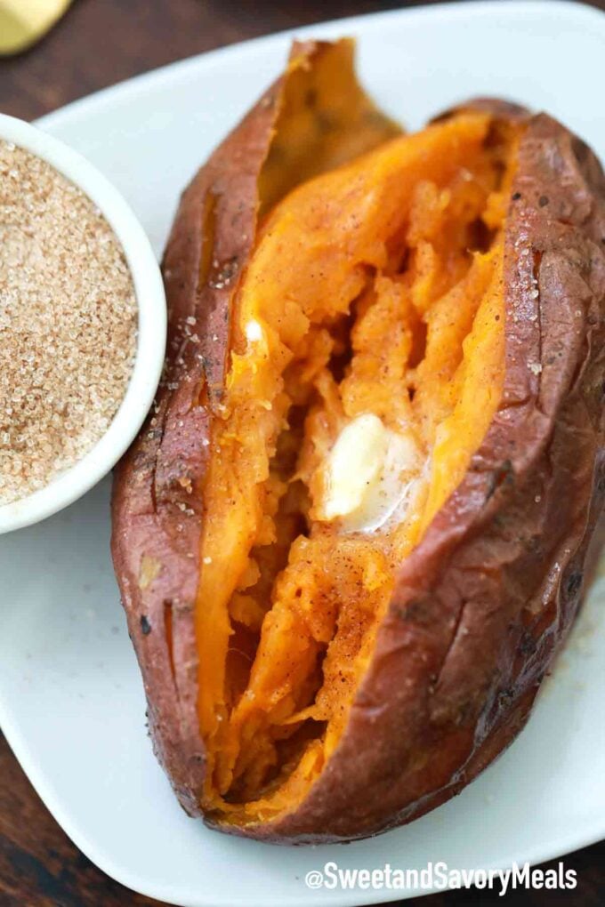 Sweet potatoes with butter on a white plate