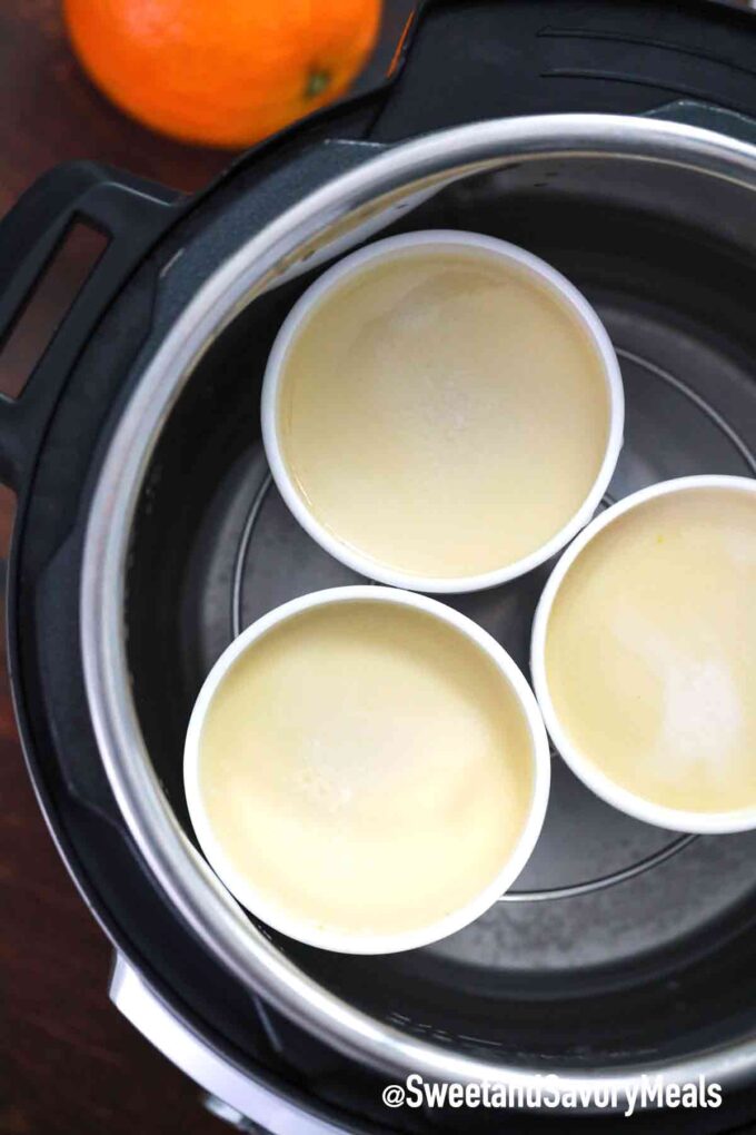 instant pot flan mixture in ramekins on a trivet