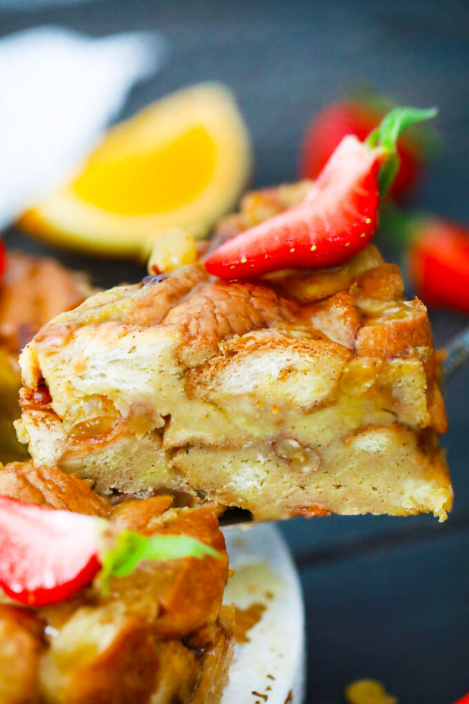 A slice of Instant Pot bread pudding on a serving spatula.