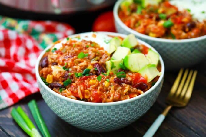 Two bowls of Instant Pot Mexican casserole with rice and ground beef.