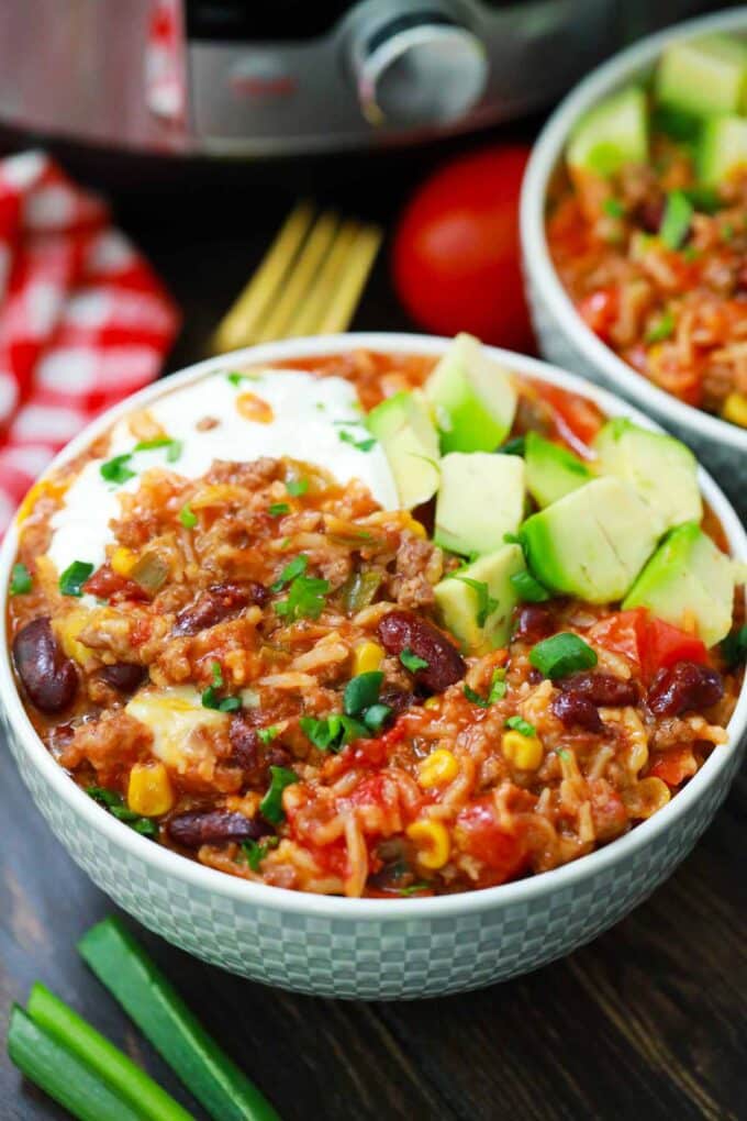Bowls of Instant Pot Mexican rice and beef casserole.