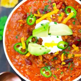 pressure cooker mexican chili topped with avocado sour cream and cheese