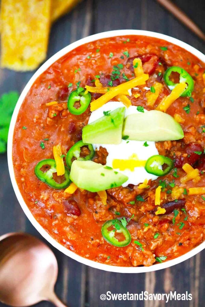 pressure cooker mexican chili topped with avocado sour cream and cheese