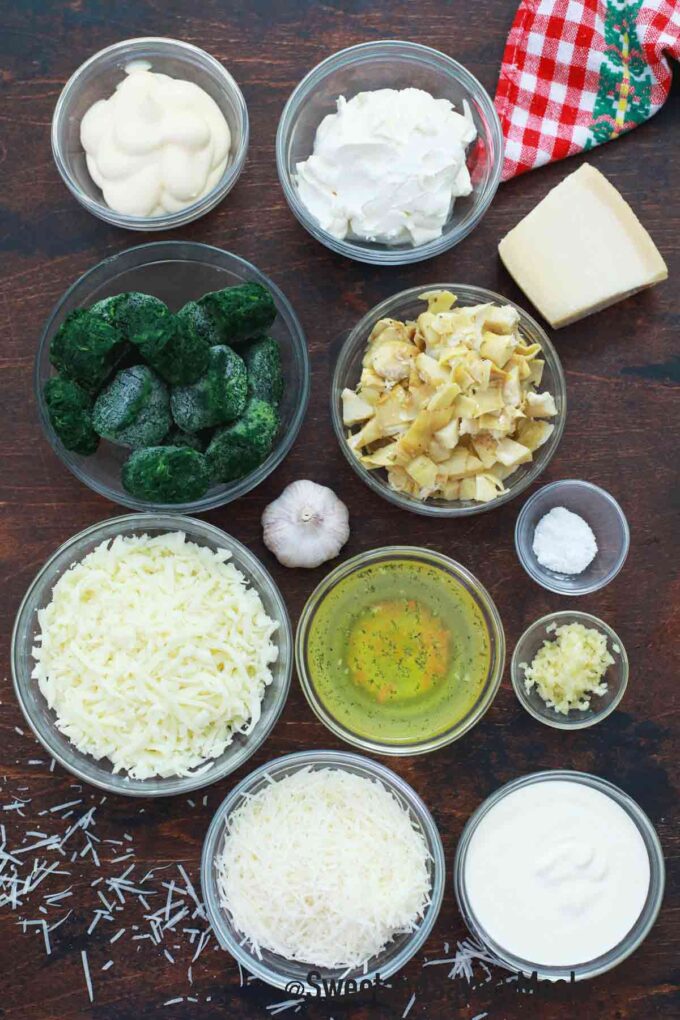 instant pot spinach artichoke dip ingredients on a wooden table