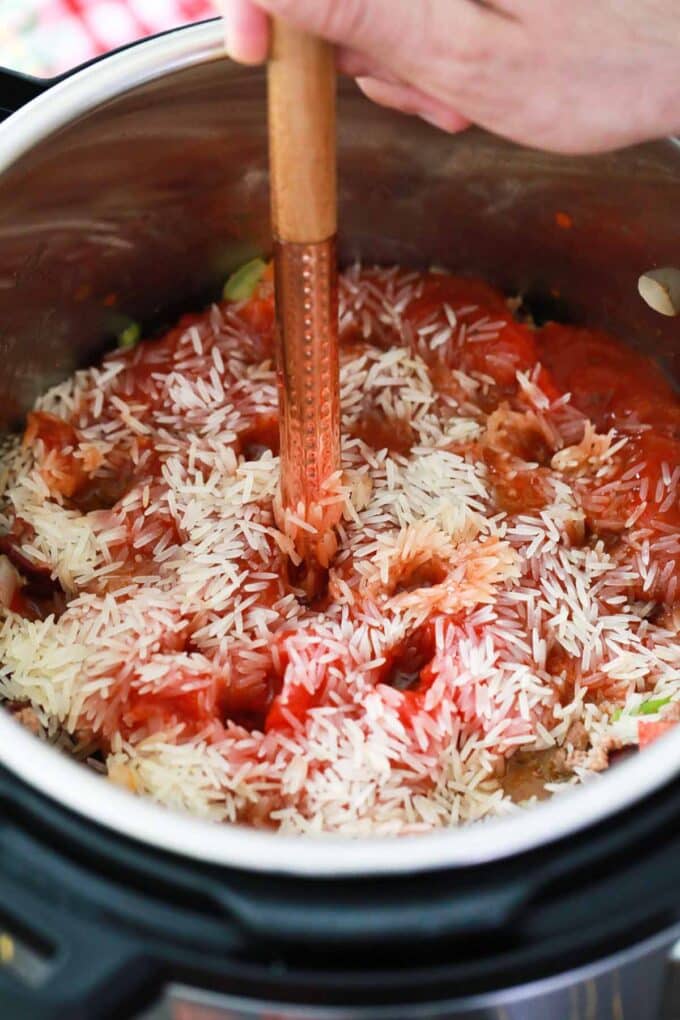 Poking holes in Instant Pot Mexican casserole before pressure cooking it.