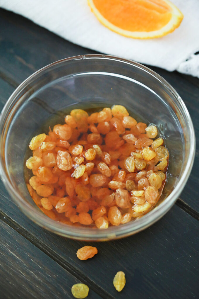 Soaking raisins in hot water.