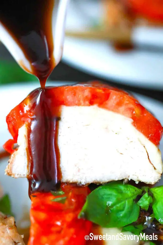 balsamic reduction on a piece of caprese chicken