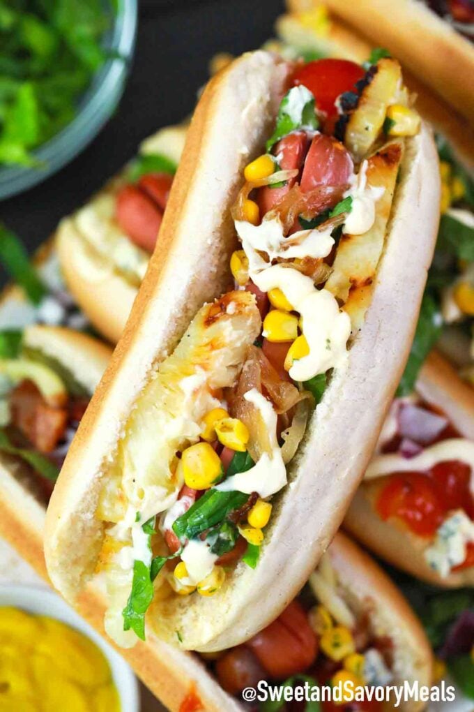 hot dog with grilled pineapple and corn