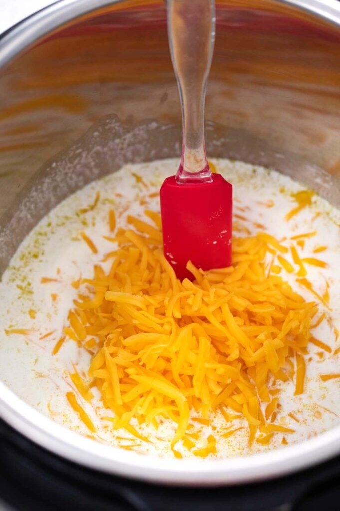 Making cheese sauce with cheddar cheese in the instant pot.
