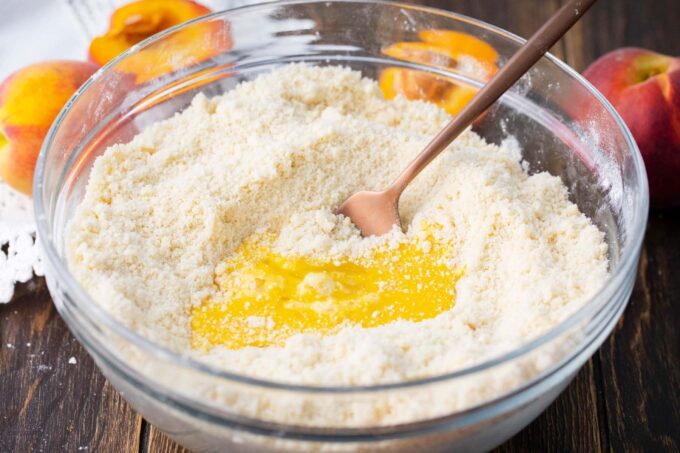 Melted butter in a bowl of flour.