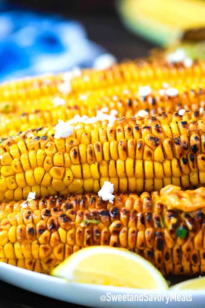 grilled corn topped with feta cheese
