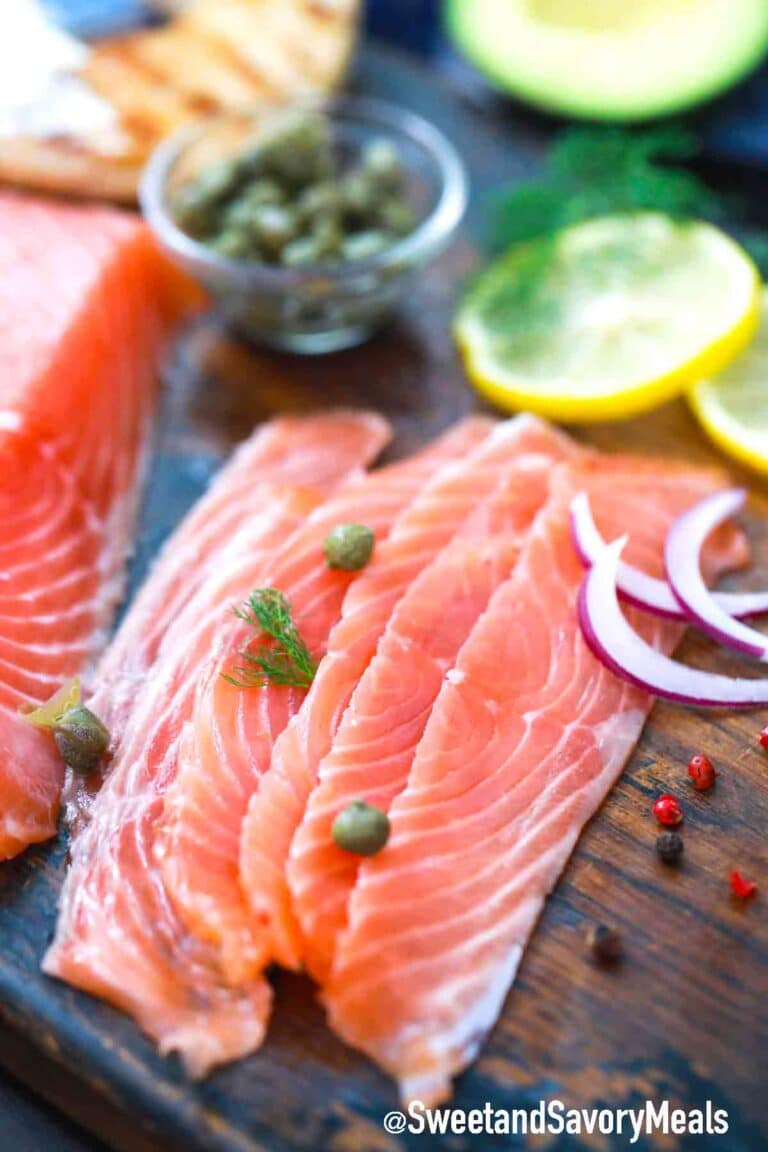 sliced homemade lox on a wooden board