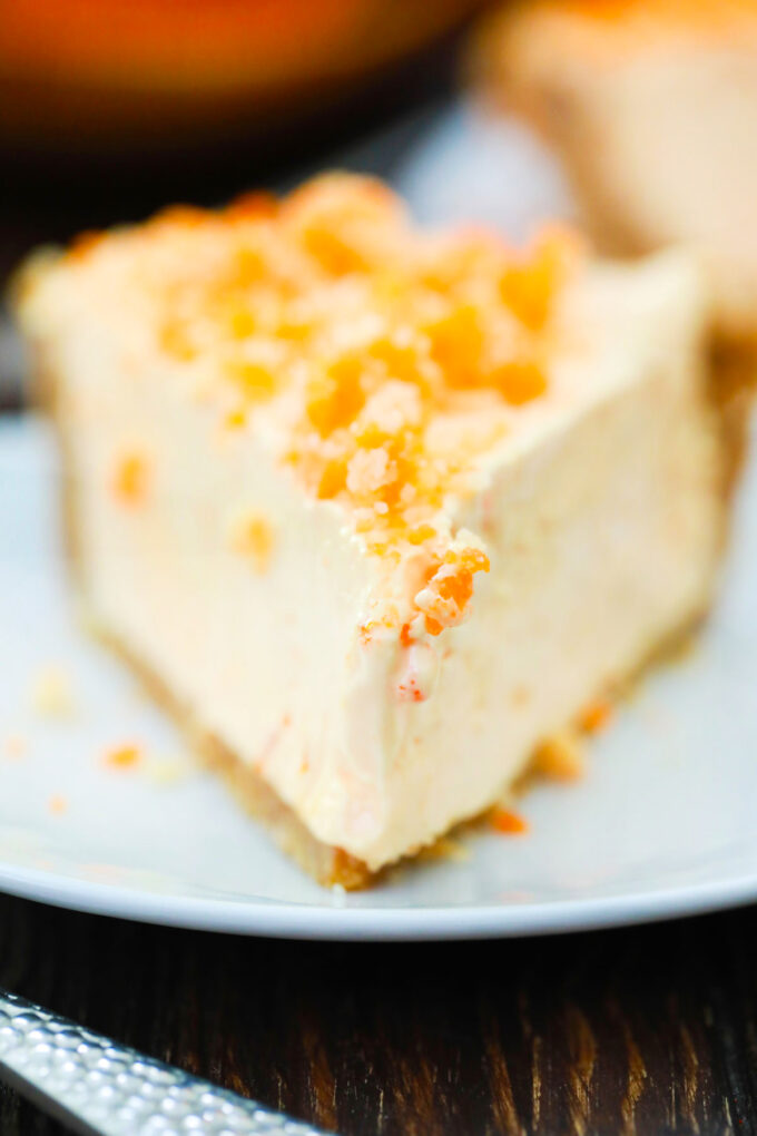 A slice of creamy orange creamsicle pie.