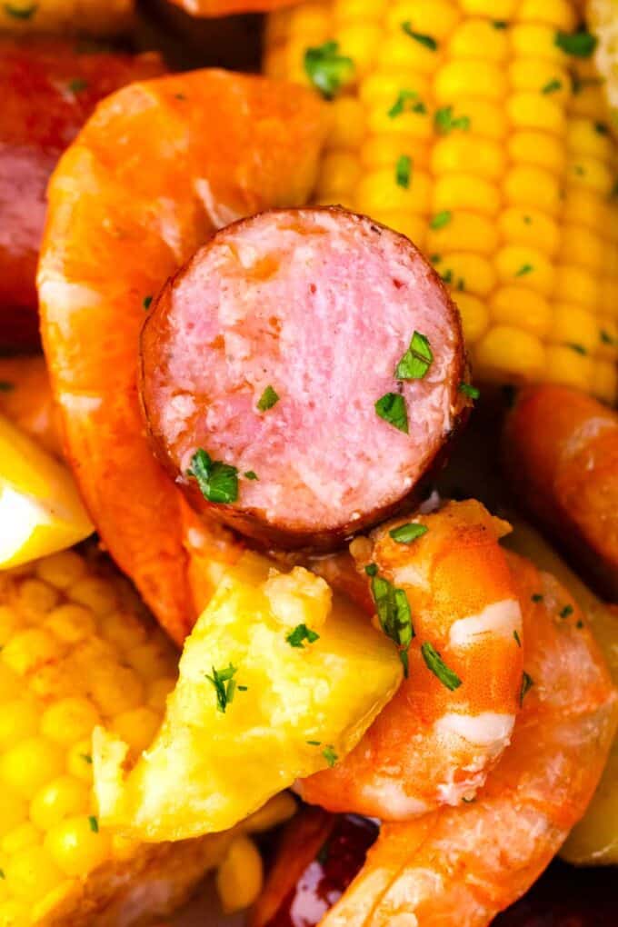 Close shot of instant pot shrimp boil with sausage pieces and corn.