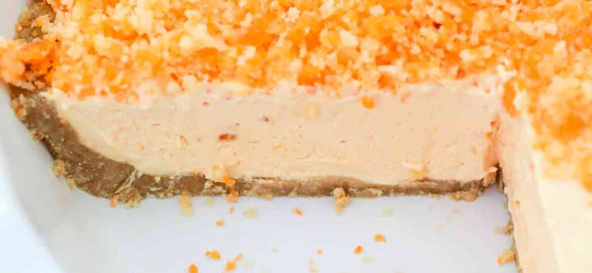orange creamsicle freezer pie in a white pie dish