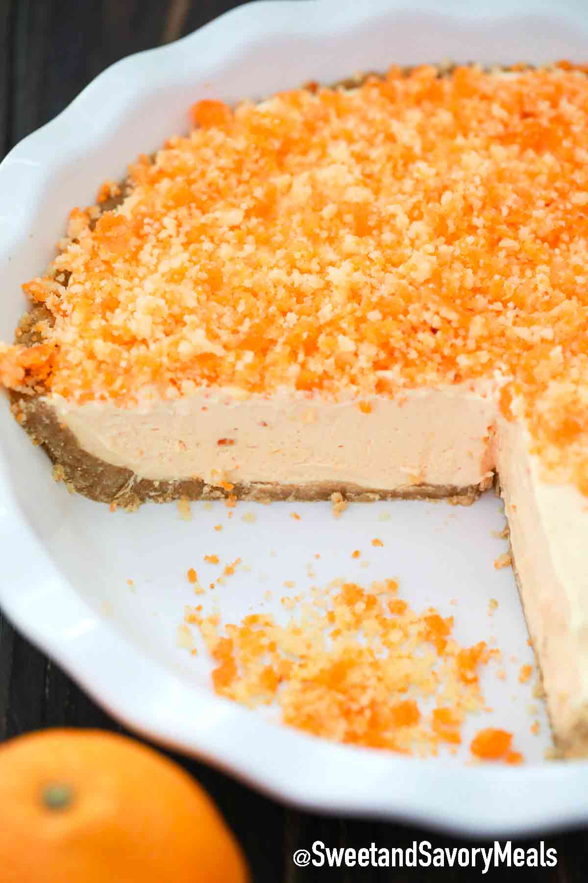 orange creamsicle freezer pie in a white pie dish