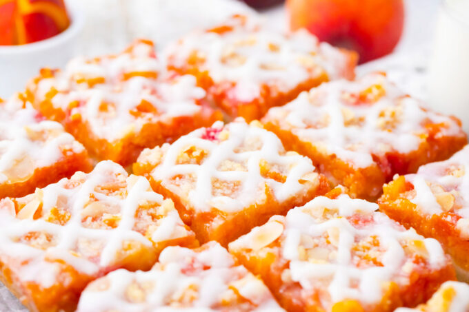 Sliced, glazed peach crumb bars/