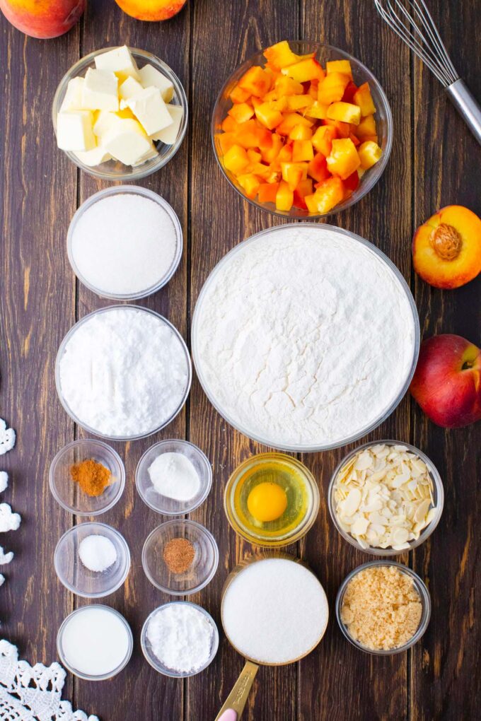 Overhead shot of peach crumb bars ingredients in bowls on a table.