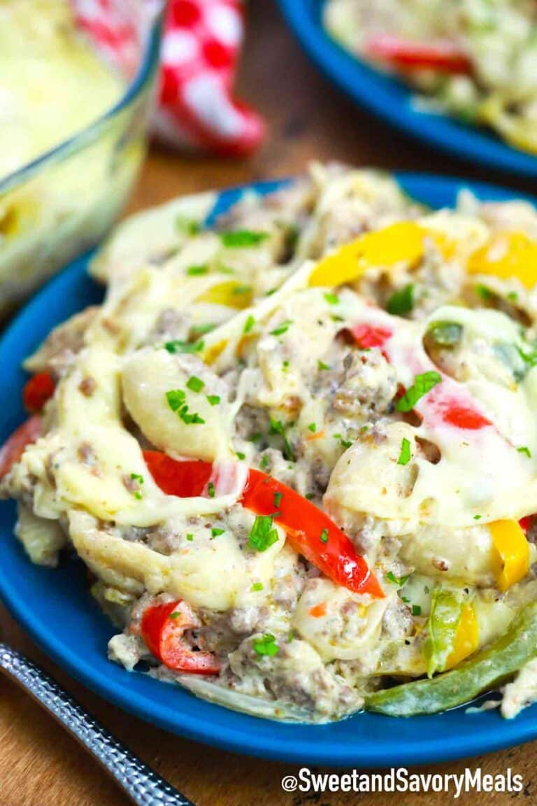 Philly cheesesteak casserole serving on a blue plate