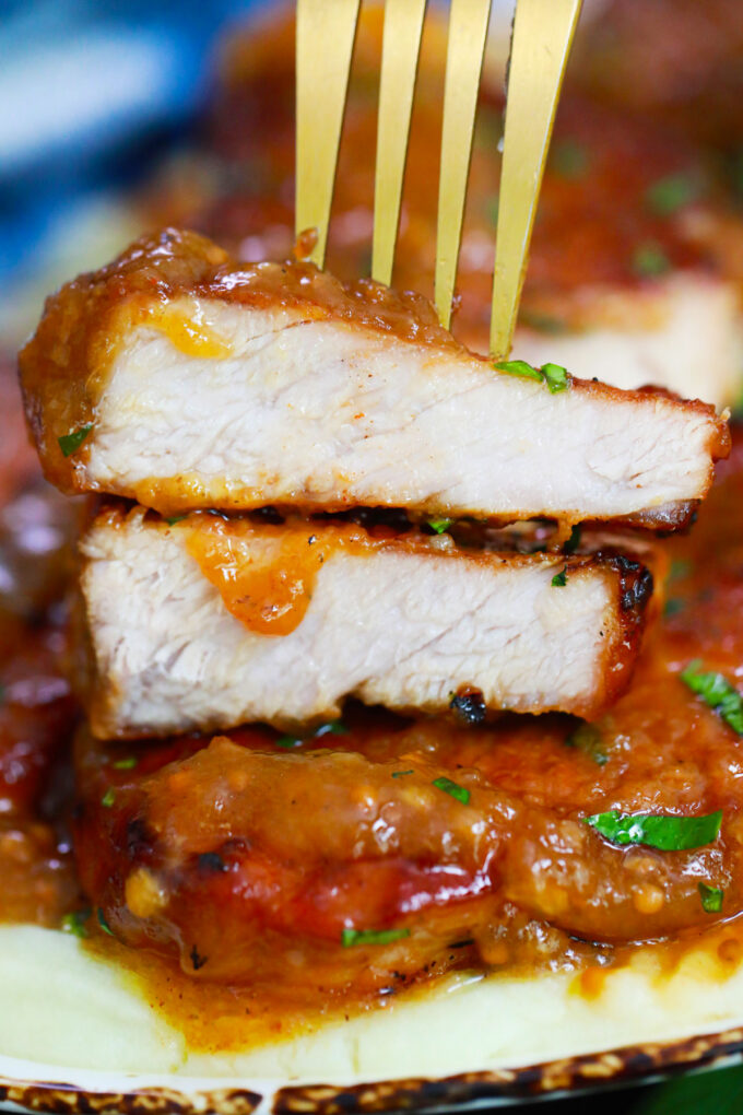 Juicy, sliced Instant Pot honey garlic pork chops.