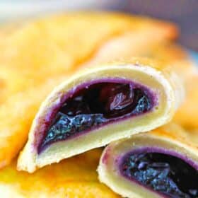 blueberry hand pie sliced in half