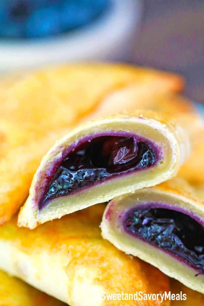 blueberry hand pie sliced in half