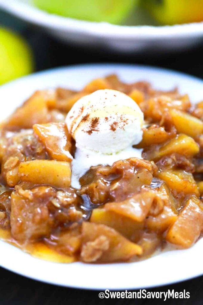 a bowl of apple crisp topped with ice cream