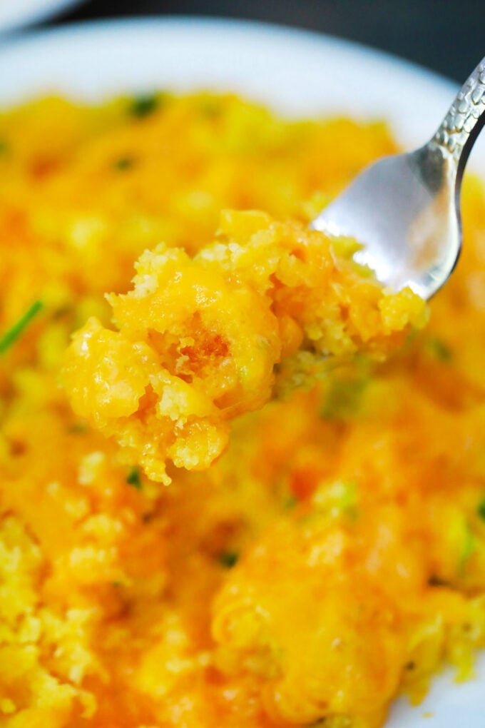 A forkful of cheesy instant pot corn casserole.