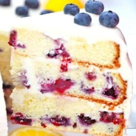 a slice of a blueberry lemon layer cake