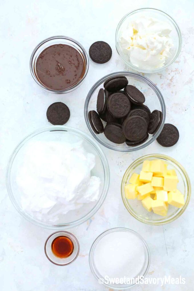 oreo pie ingredients in small bowls on a table