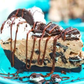 oreo pie slice with whipped cream chopped and Oreos