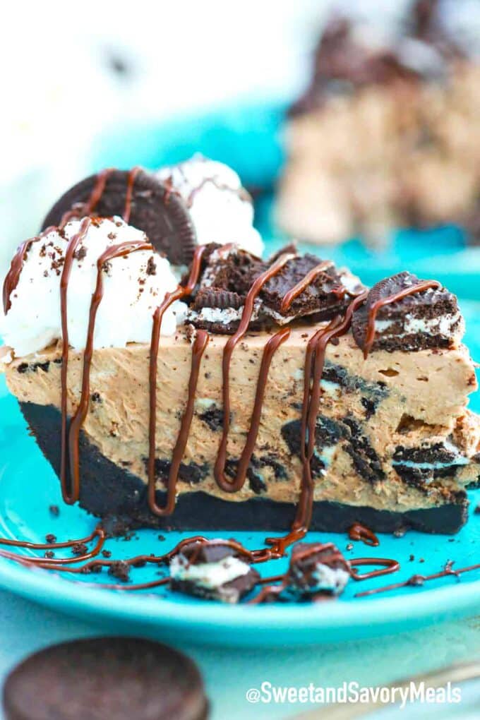 oreo pie slice with whipped cream chopped and Oreos