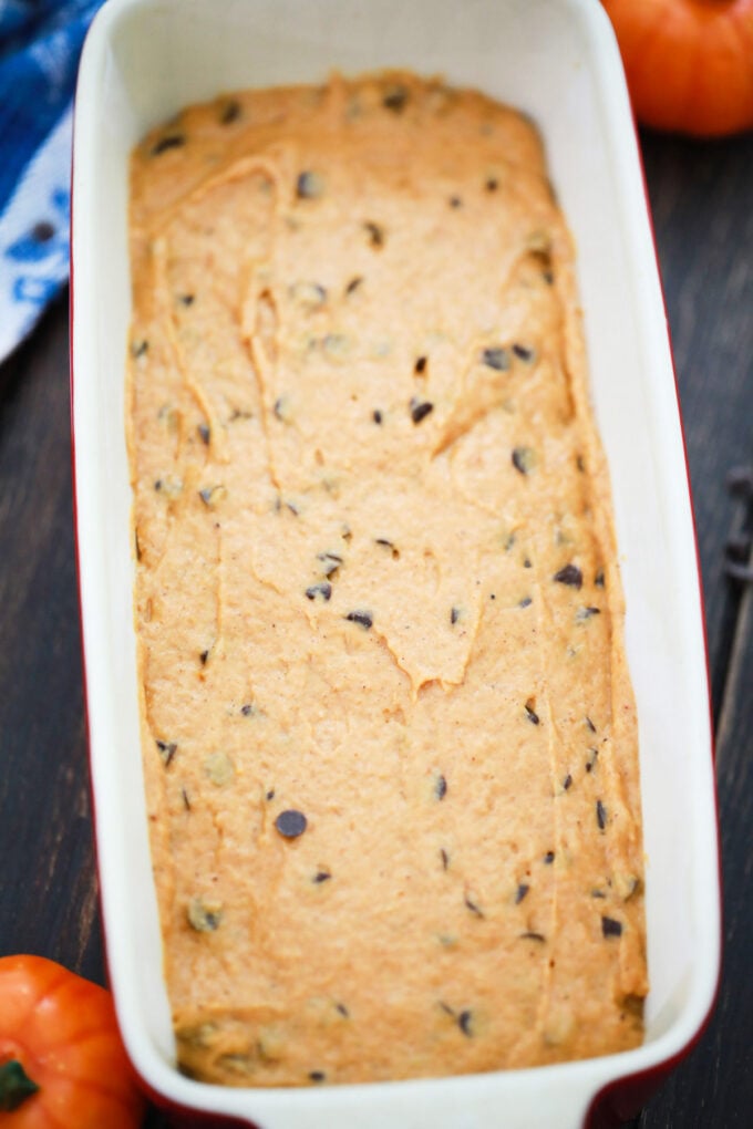 Chocolate chip pumpkin bread batter in a loaf pan.