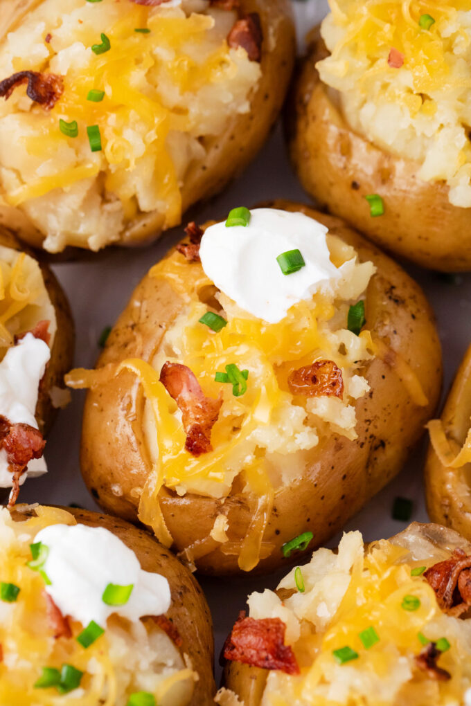 Tender and fluffy slow cooker baked potatoes.