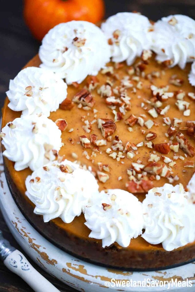 pumpkin pie with whipped cream and pecans