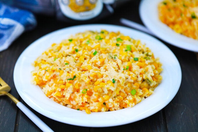 Serving creamy slow cooker corn casserole.