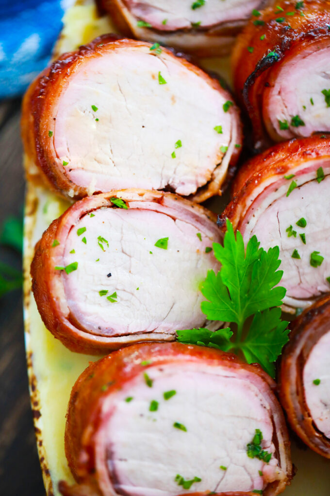 Juicy air fryer bacon wrapped pork tenderloin medallions.