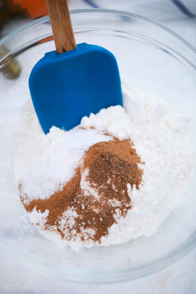 Mixing dry ingredients for pumpkin roll.