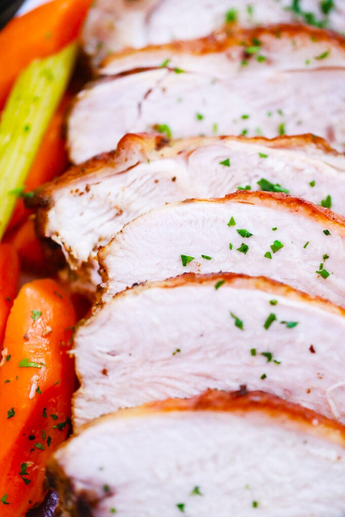 Sliced slow cooked turkey breast with vegies.
