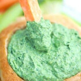 carrot stick dipped in spinach dip