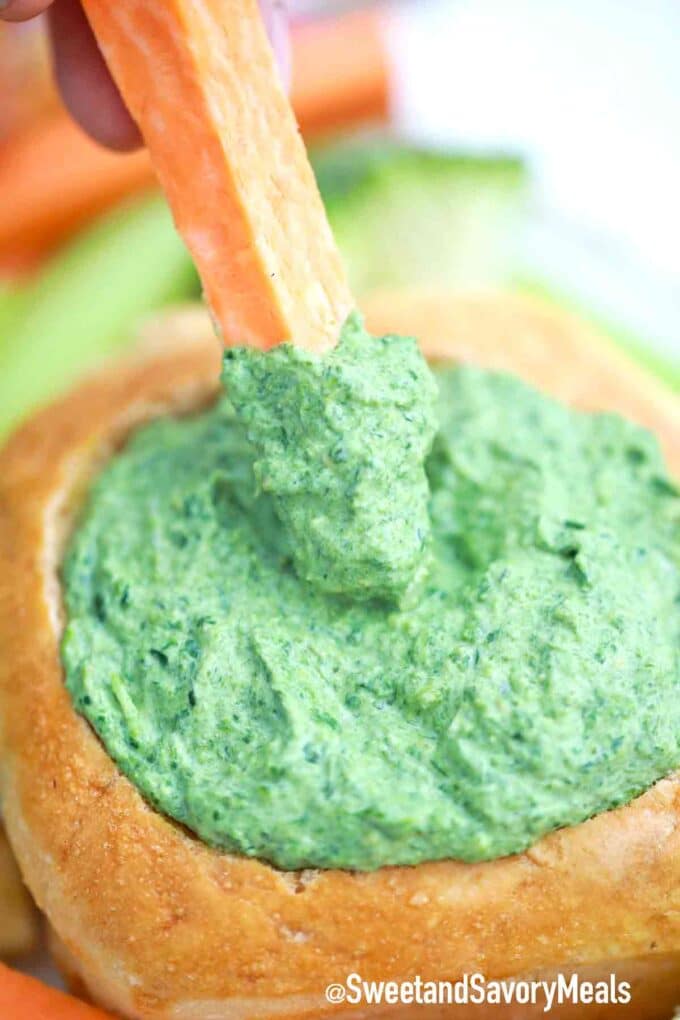 carrot stick dipped in spinach dip