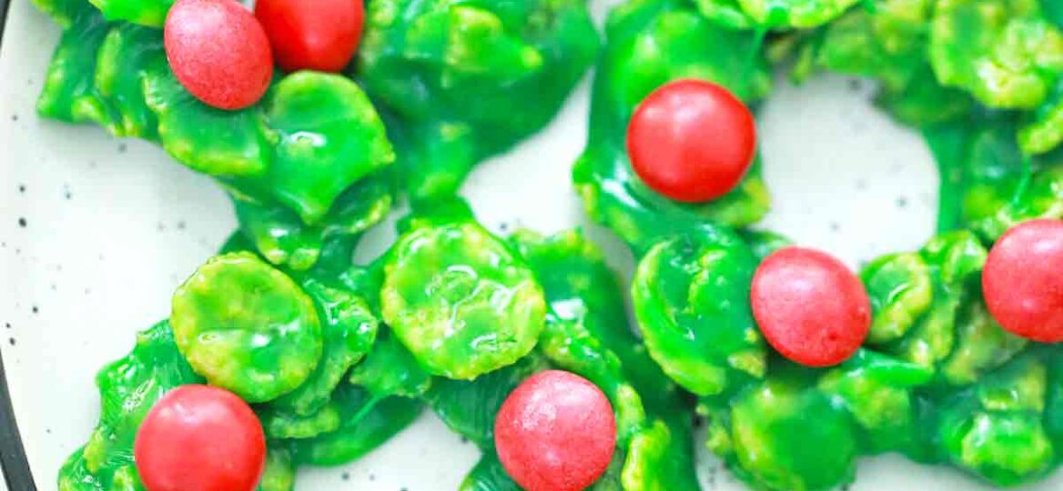 a plate of green and red christmas wreath cookies