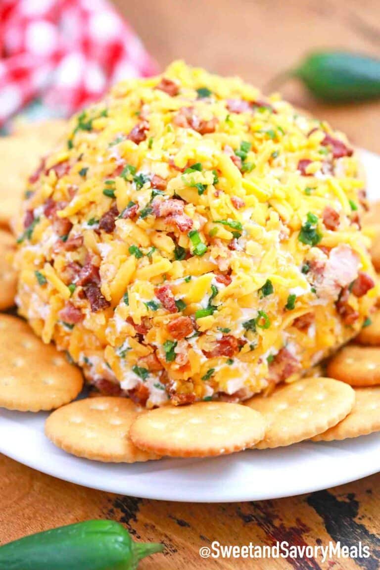 jalapeno popper cheese ball on a plate with crackers